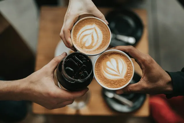 Two lattes with latte art served at a specialty café