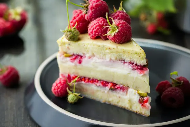 Slice of raspberry layer cake on a plate